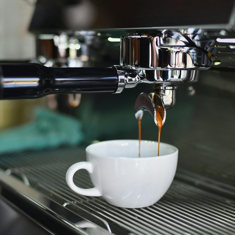 Espresso pouring in a cup