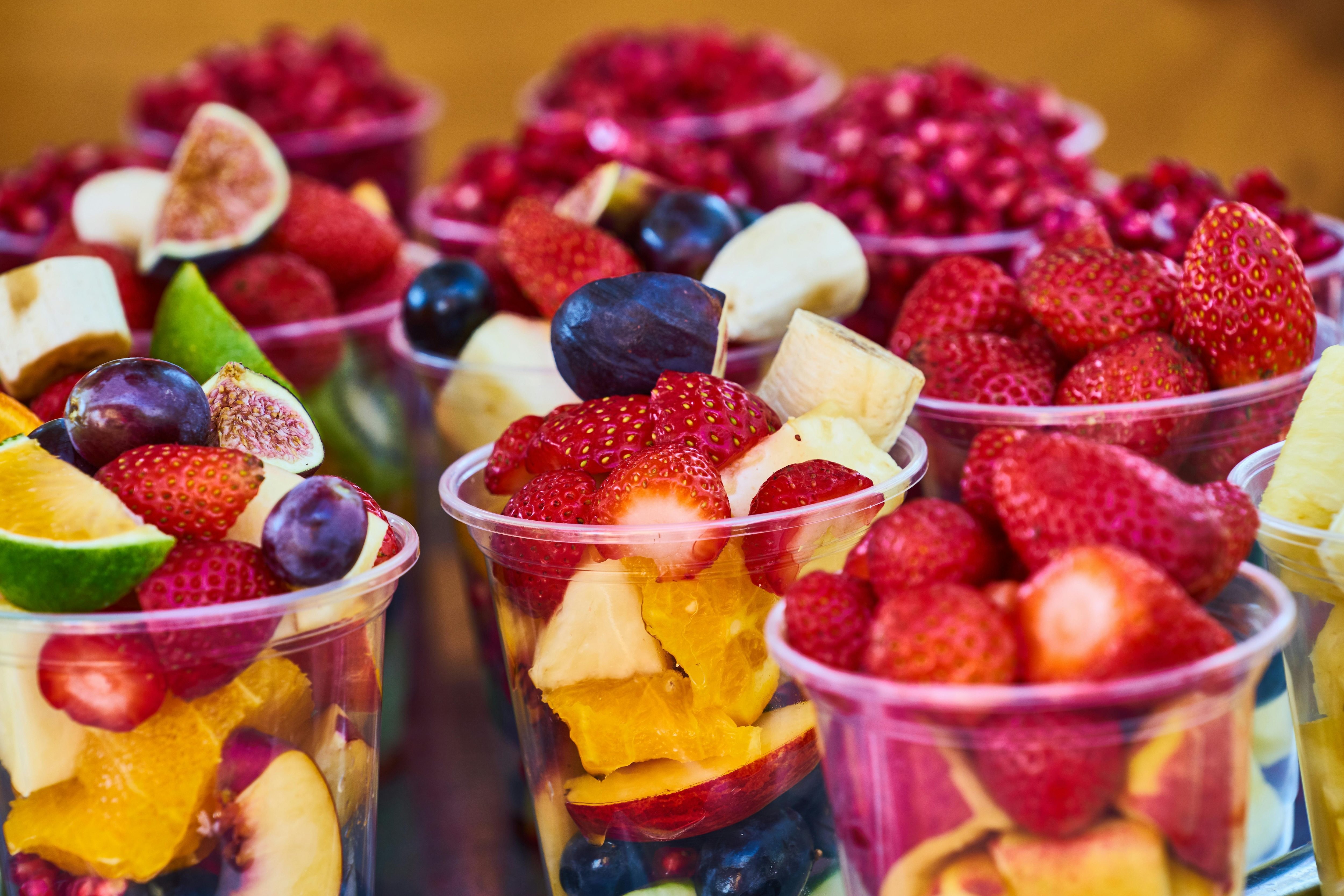 Cups with colorful fruit pieces inside