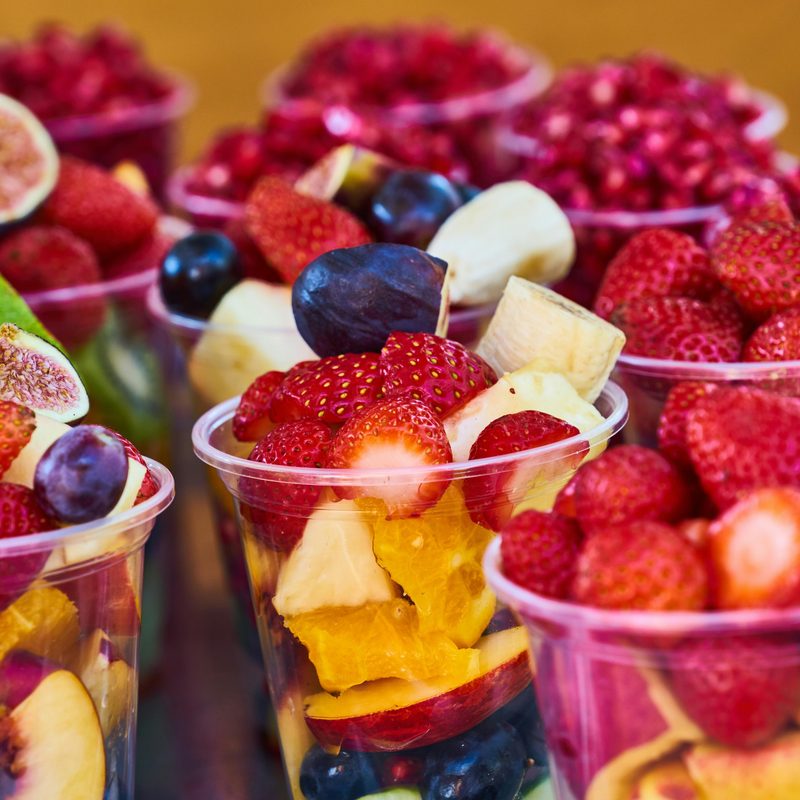 Cups with colorful fruit pieces inside