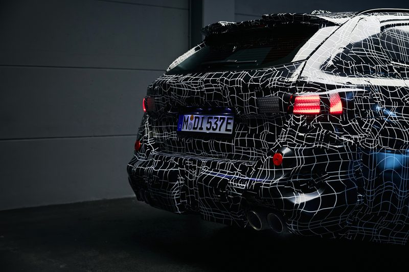 2025 BMW M5 Touring right rear and part of the rear quarter panel camoflaged (European model).