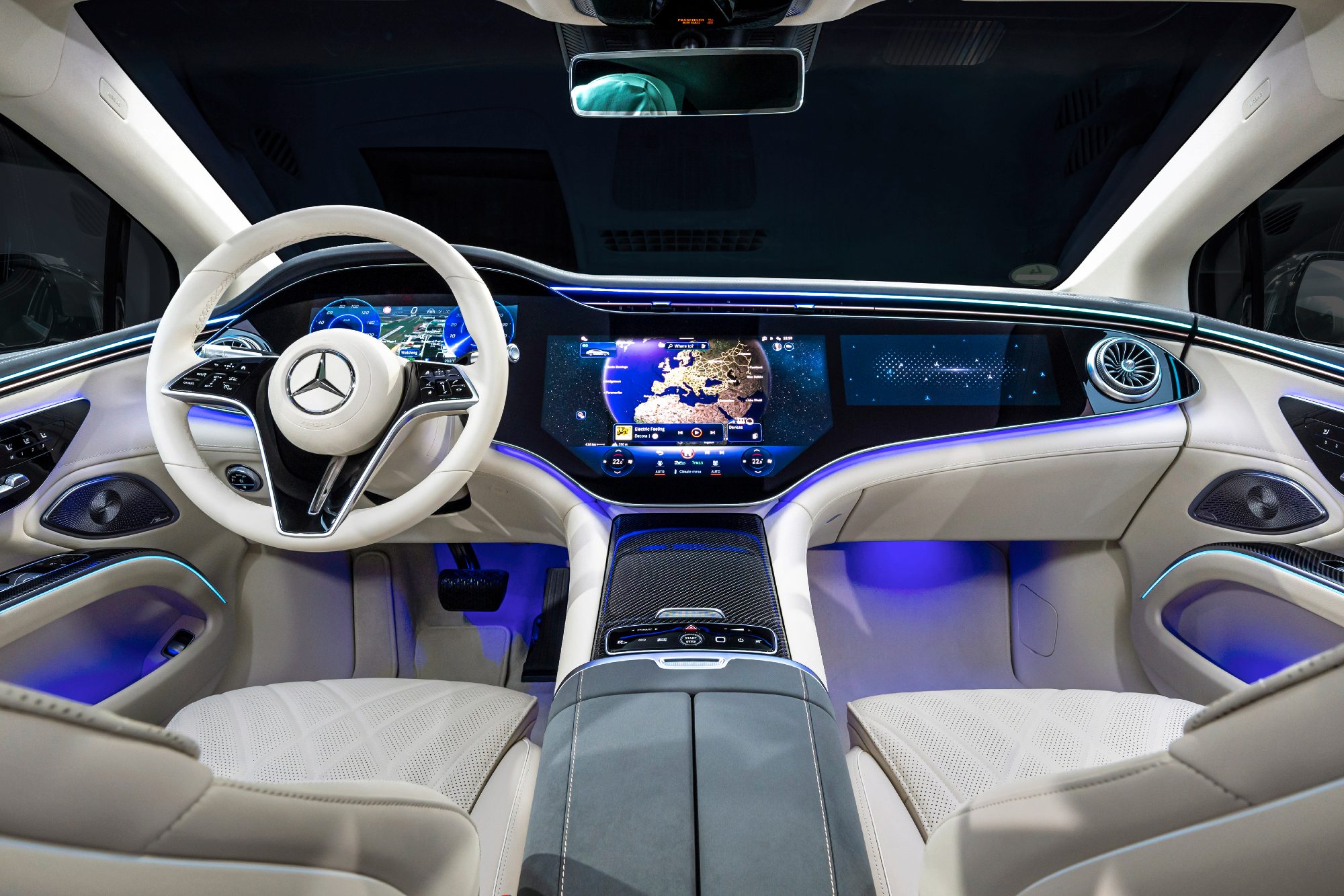2025 Mercedes-Benz EQS in Obsidian Black view from center of back set forward showing the entire front seats and dashboard.