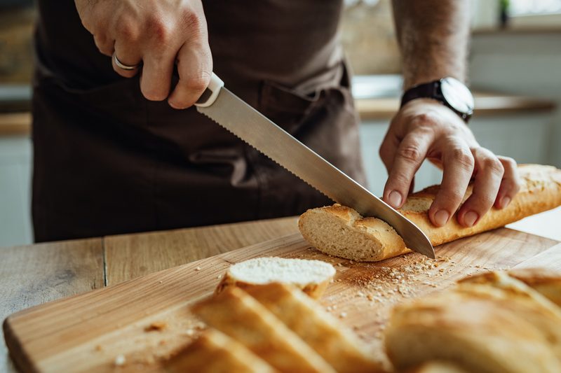 Man slicing bread