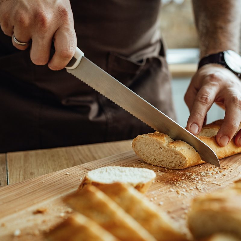 Man slicing bread