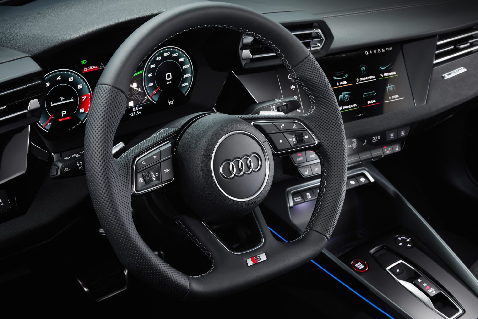 Blue 2025 Audi S3 view of driver's cockpit and dah front just inside the open driver door.