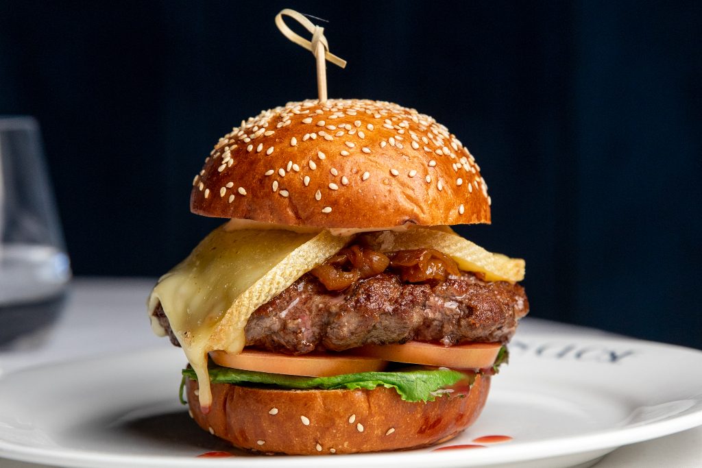 side shot of Maison Close burger.