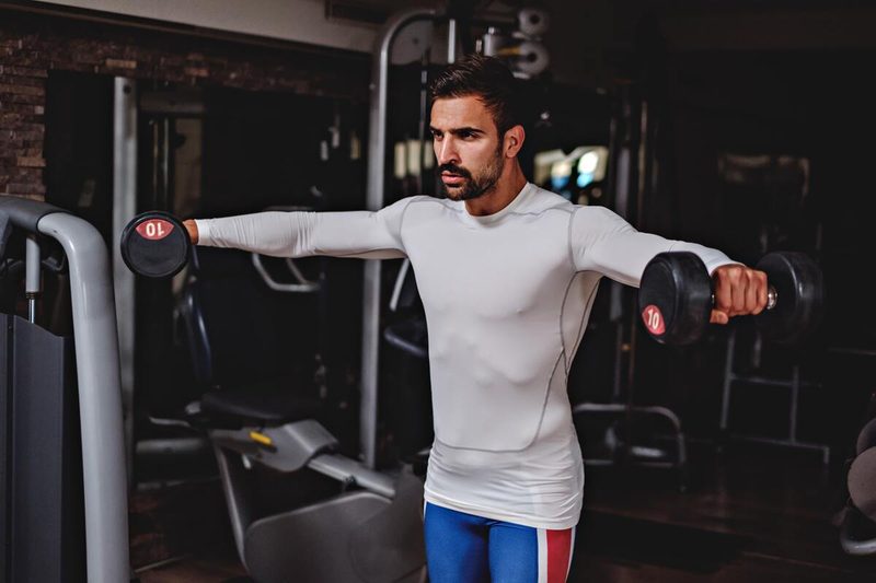 Man doing lateral raises.