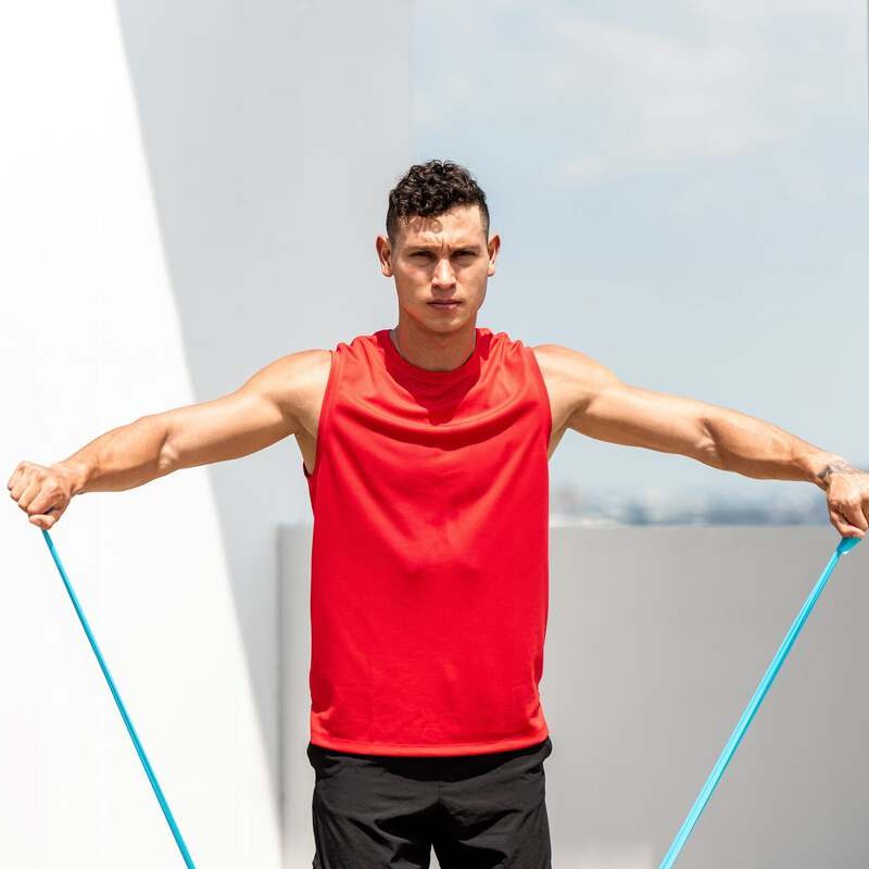 Man doing lateral raises with straps