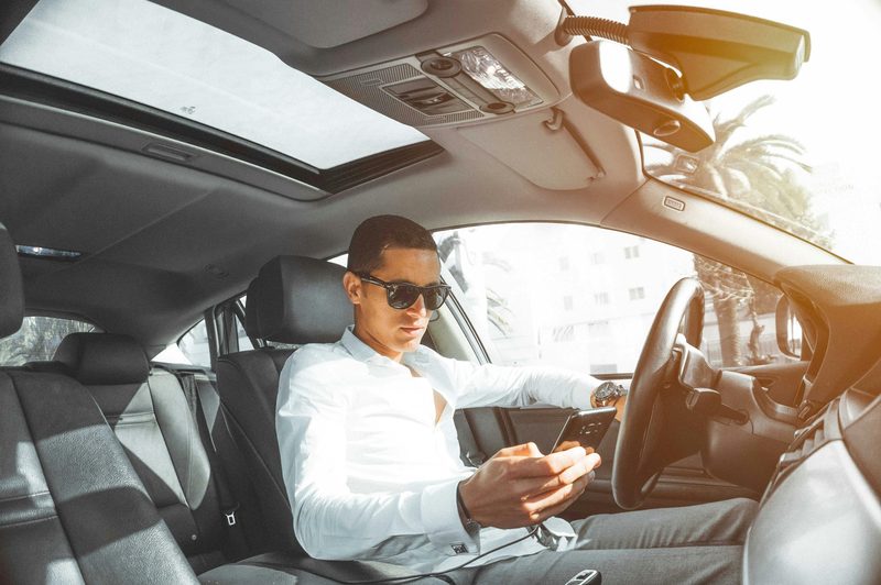 Man in a car on his phone