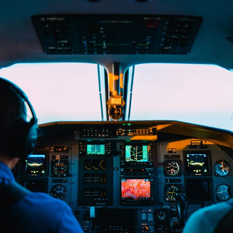 Airplane cockpit with pilot and copilot