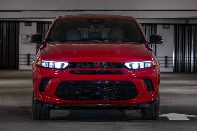 Red 2024 Dodge Hornet RT in a parking garage with a direct front view.