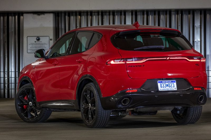 Red 2024 Dodge Hornet RT in a parking garage with a right rear three-quater view.