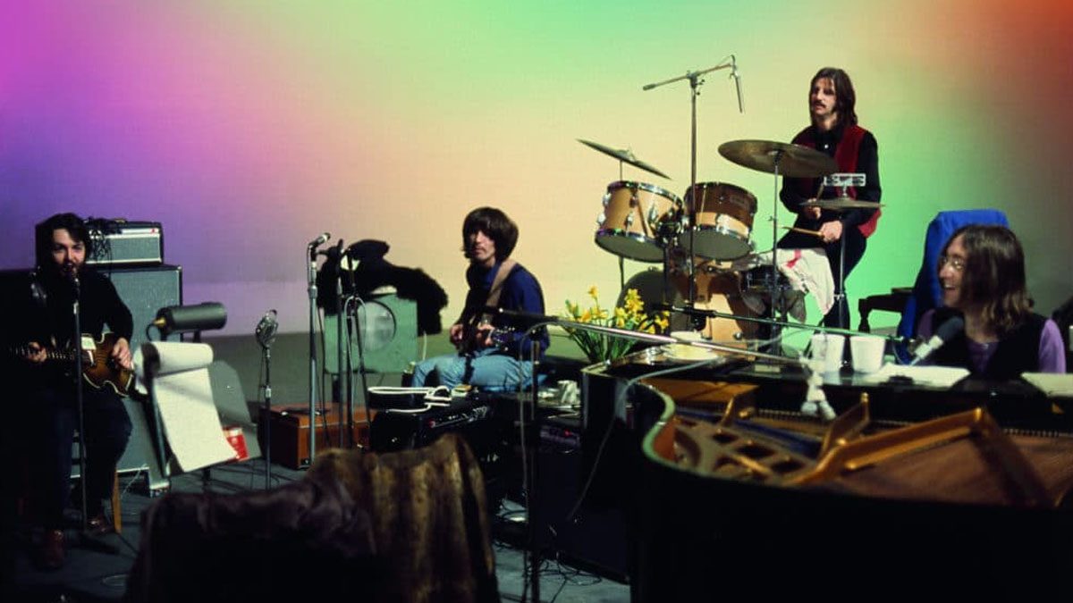 The Beatles practicing during their recording of Let It Be.