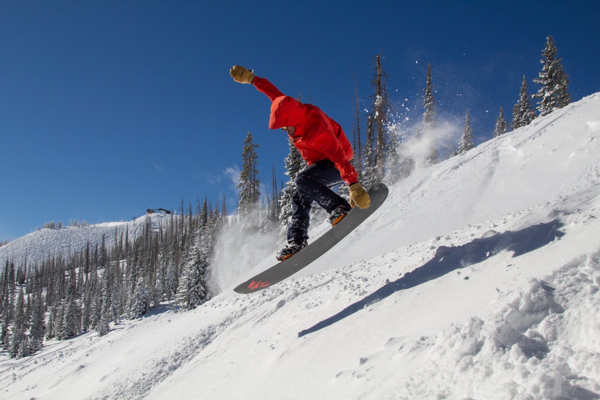Snowboarder jumping at Wolf Creek Ski Area
