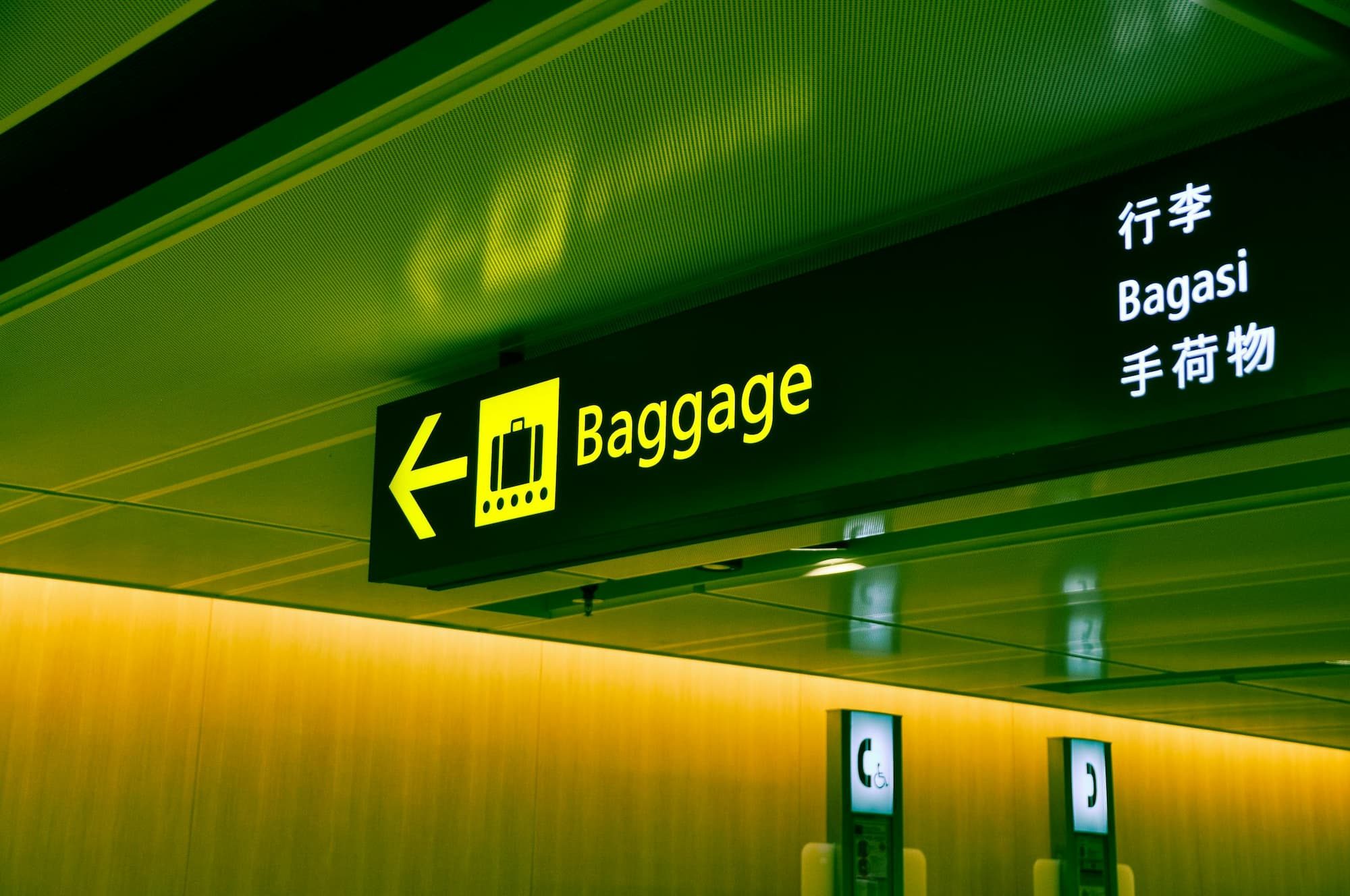 close up photo of airport baggage sign