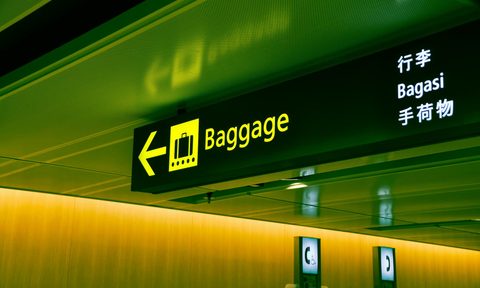 close up photo of airport baggage sign