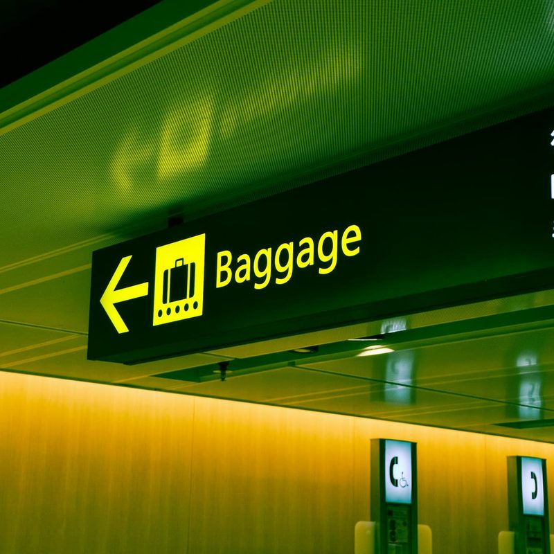 close up photo of airport baggage sign
