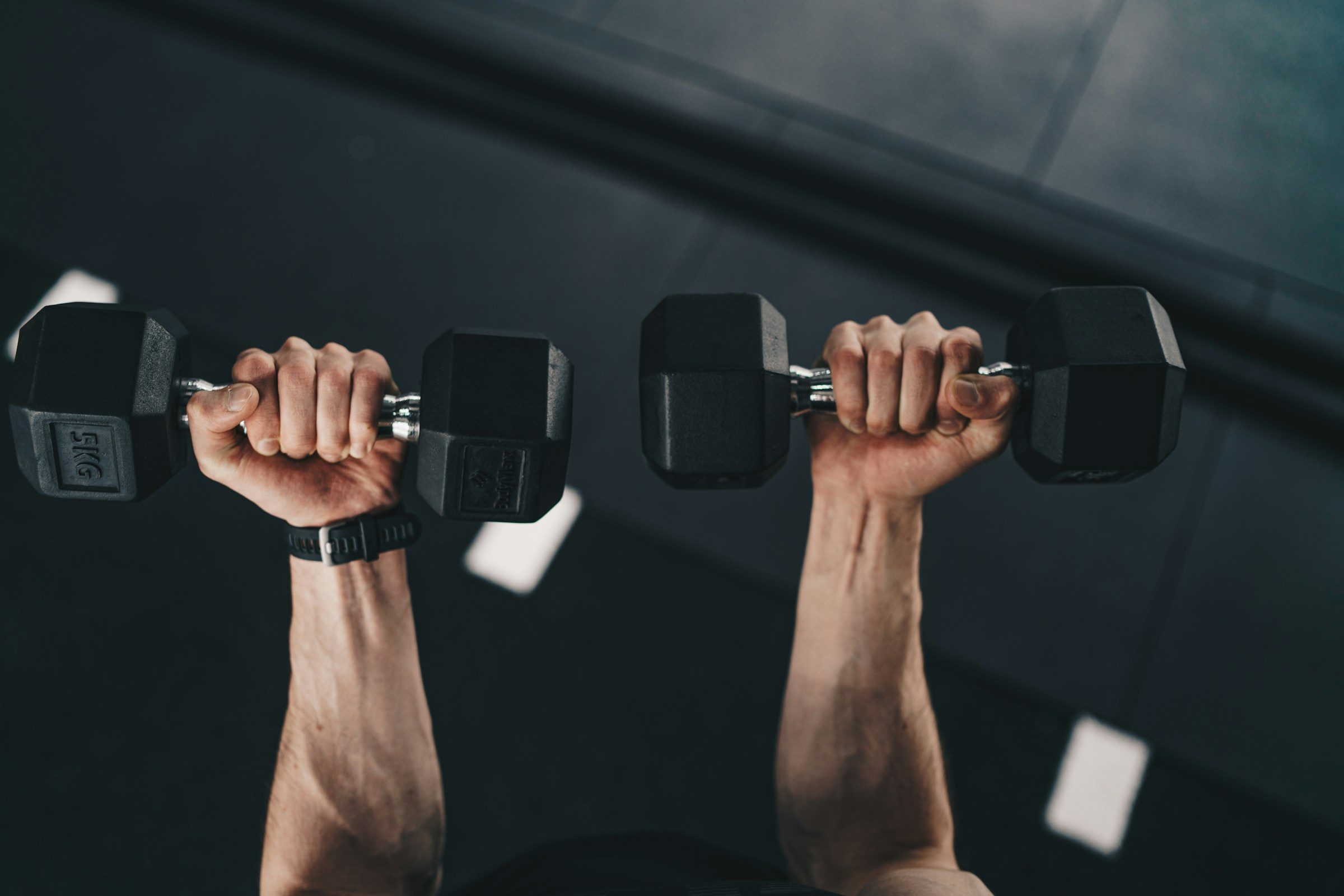man lifting weights
