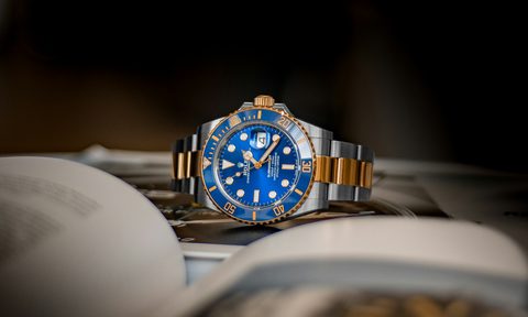 Rolex two-toned blue and silver watch.