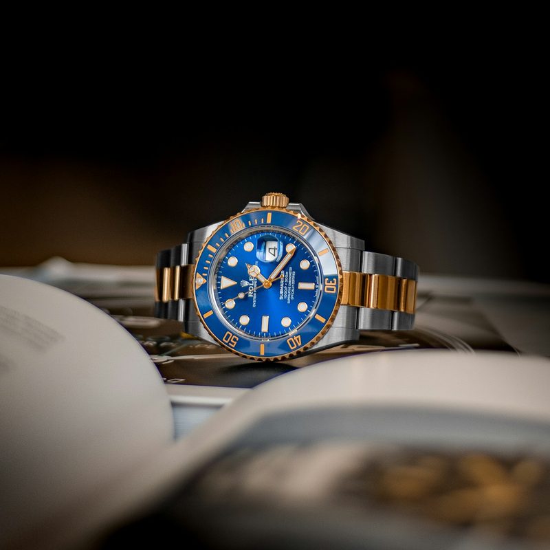 two-toned blue and silver watch