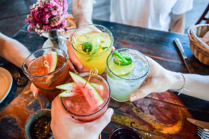 friends toasting with cocktails
