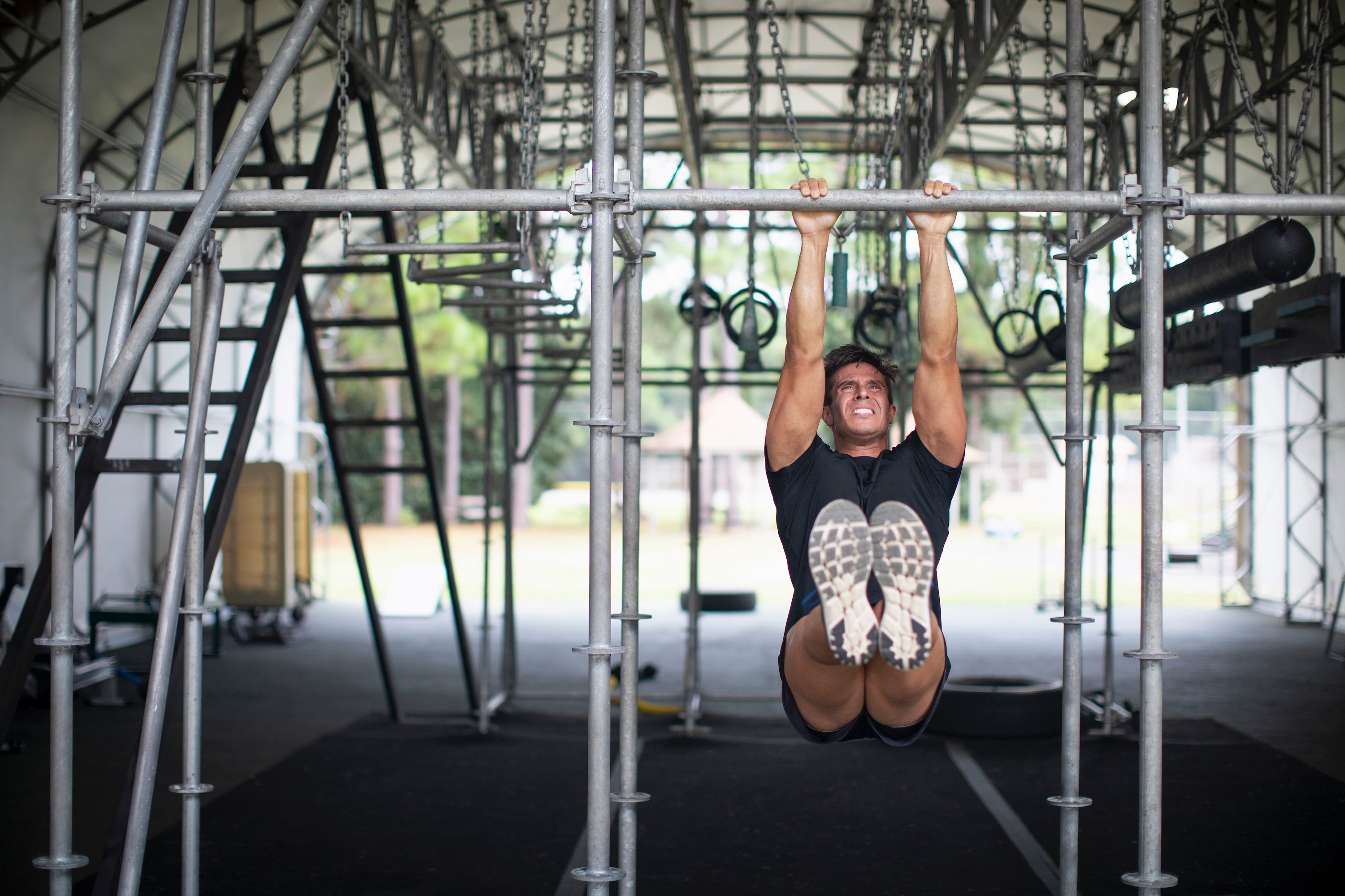 Man doing hanging hold or dead hang exercises