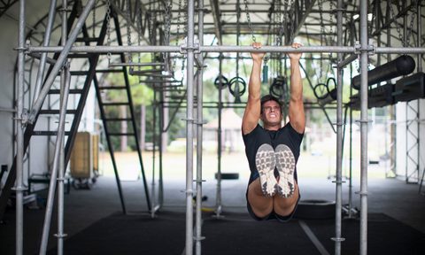 Man doing hanging hold or dead hang exercises