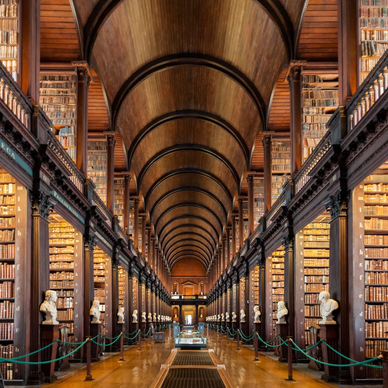 Dublin, Ireland - August 2019: Inside the Long Room of The Old Library at Trinity College Dublin during opening hours before tourists fill the room