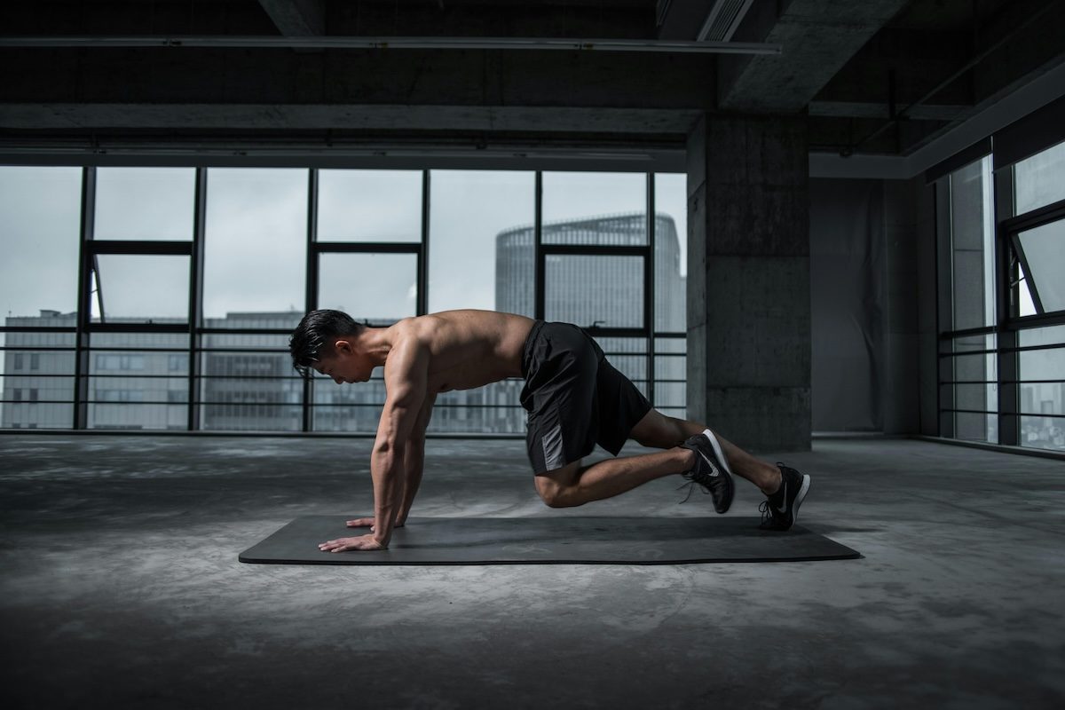 a man getting into plank pose