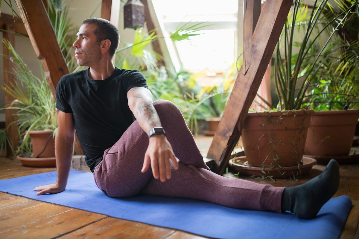 man stretching glutes