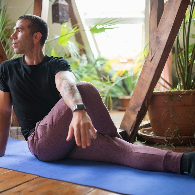 man stretching glutes