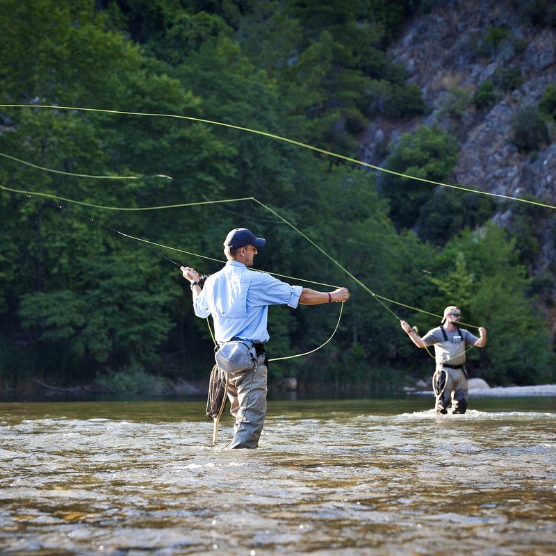 Two men fly-fishing in a river