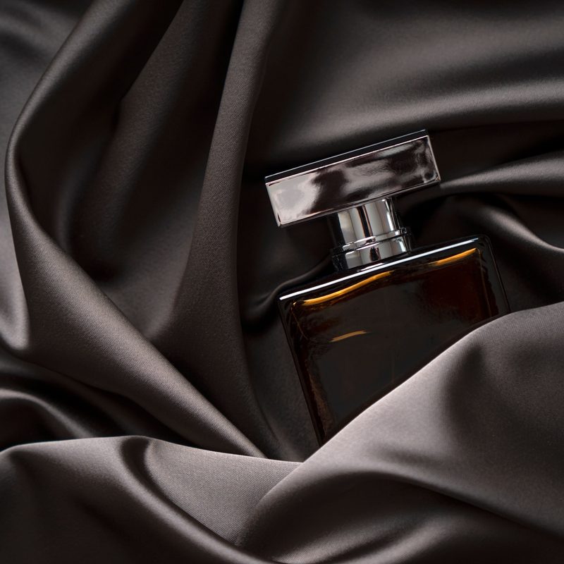 mens cologne on black satin