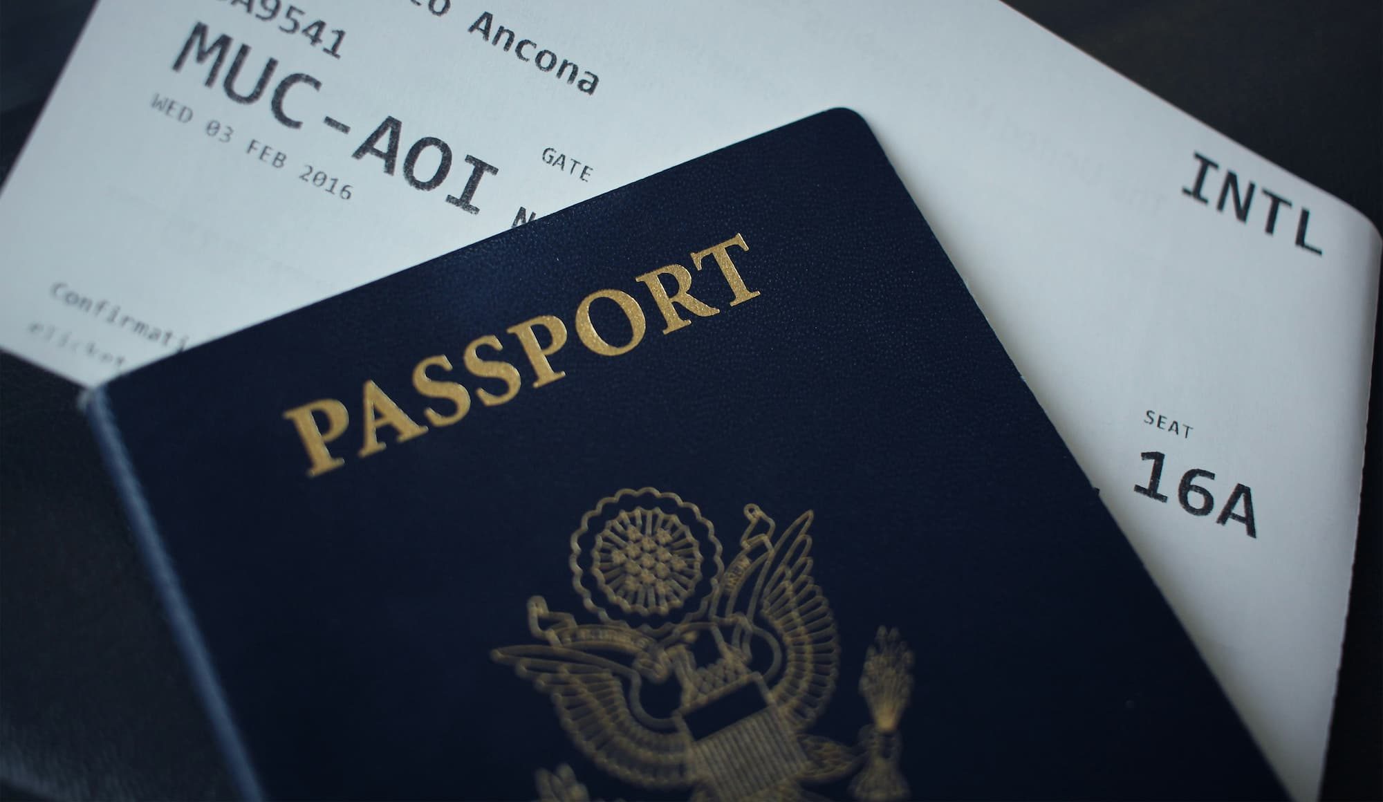 passport sitting on top of white paper