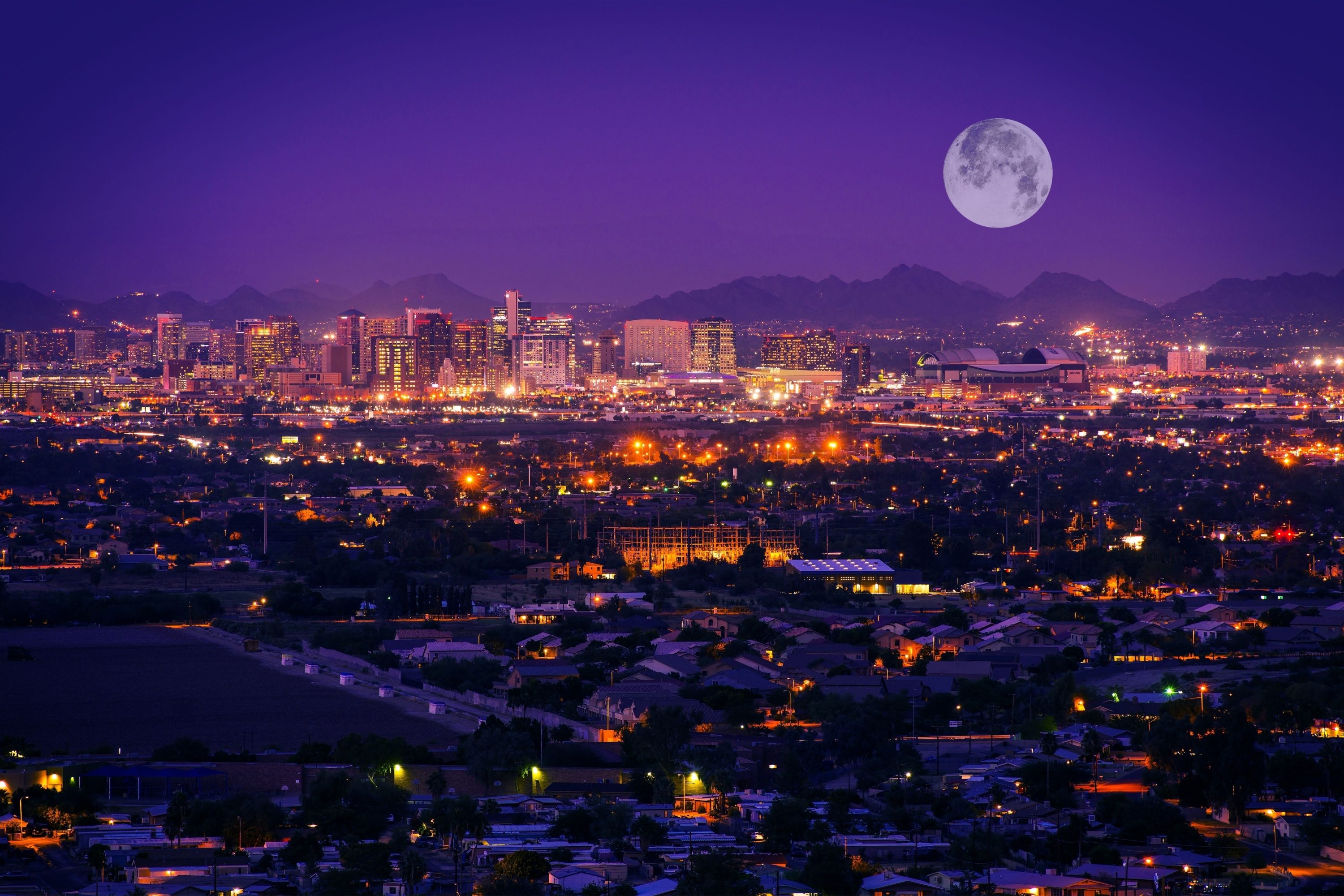 Phoenix Arizona Skyline at Night. Full Moon Over Phoenix, Arizona, United States.