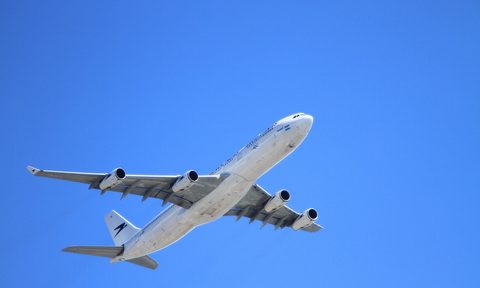 Plane in clear blue sky
