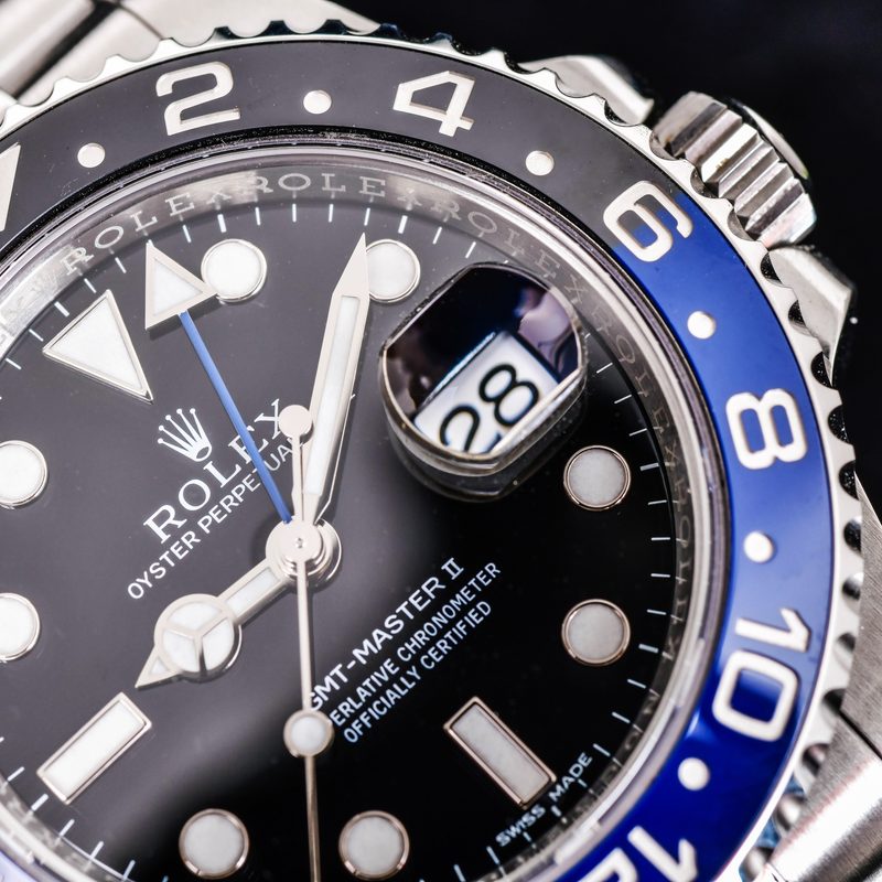 Close up Rolex GMT-Master II "Batman"40mm with blue-black bezel Steel Ceramic Men's Wrist watch on black background