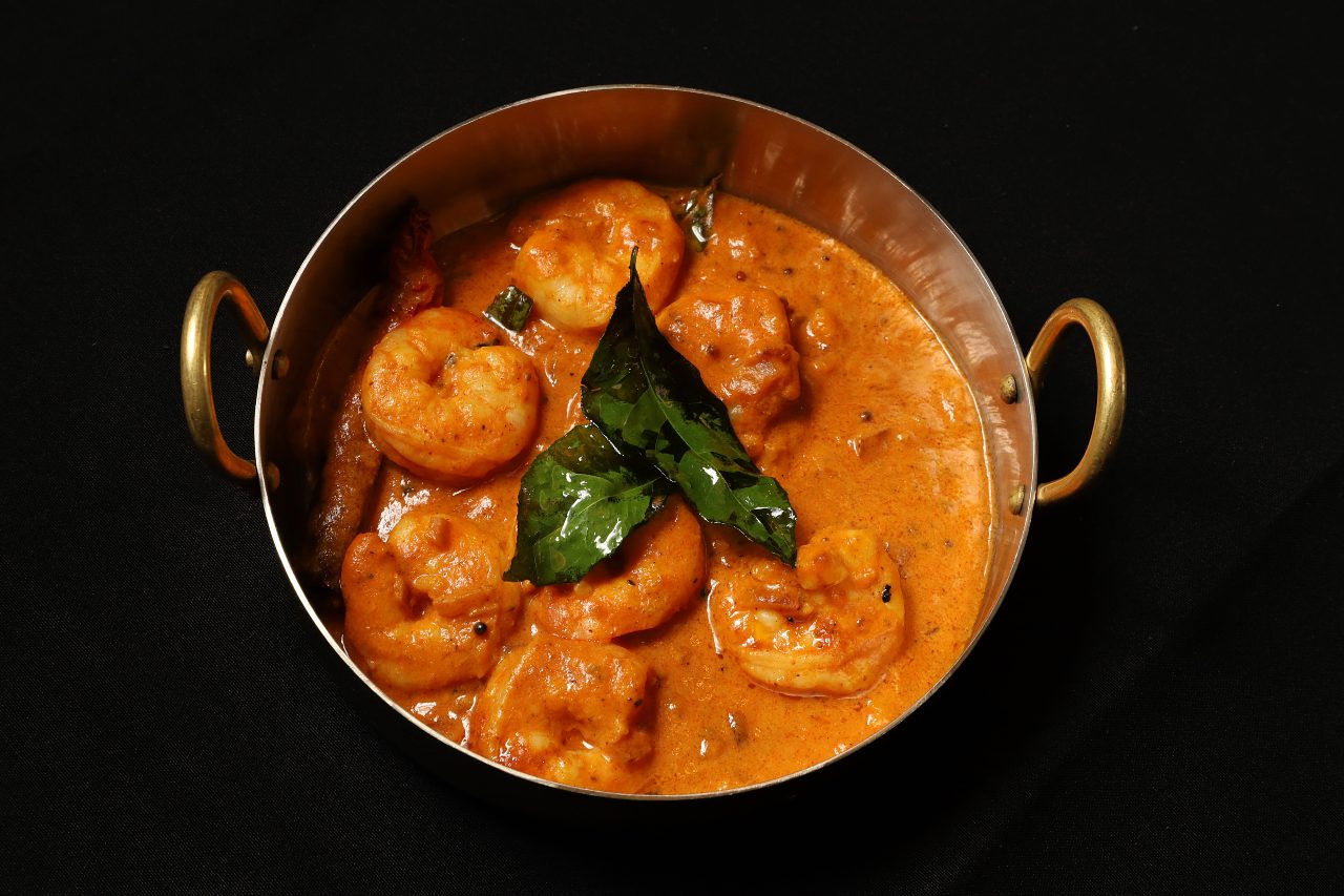 bowl of Indian shrimp black background