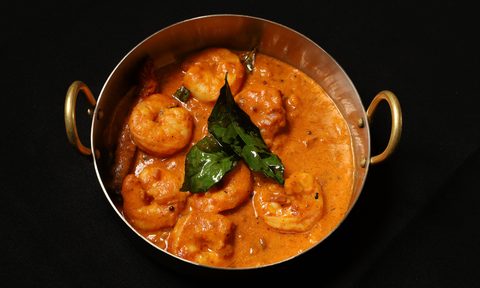 bowl of Indian shrimp black background