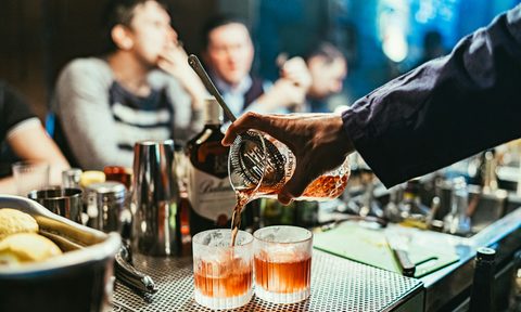 Bartender making cocktails