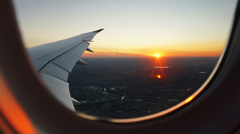 Horizon during sunrise through airplane window