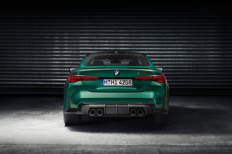 2025 BMW M4 CS direct rear shot parked in a garage witha corrugated wall.