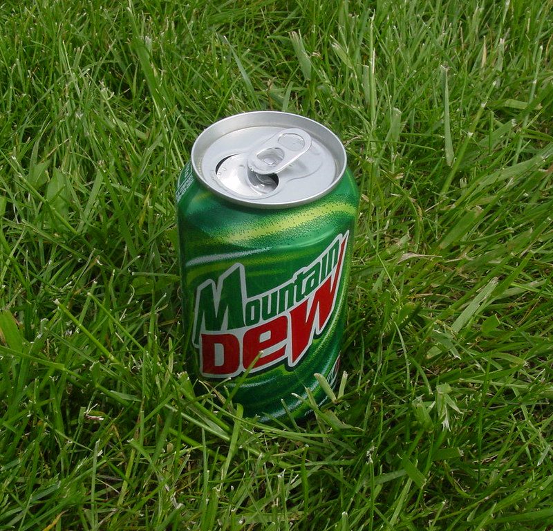 Mountain Dew can in grass