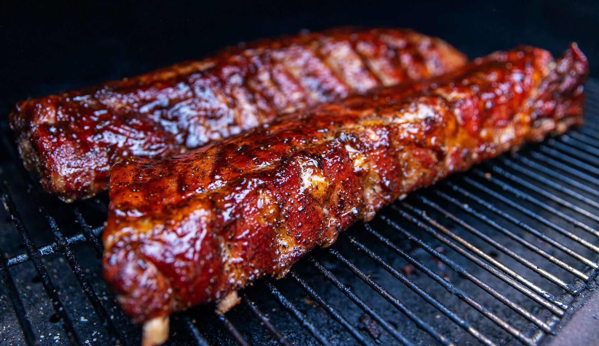 Babyback ribs cooking on a grill