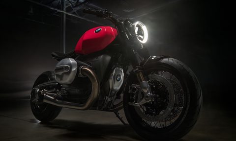 BMW Motorrad BMW R20 Concept motorcycle front right three-quarter view on dark stage setting.