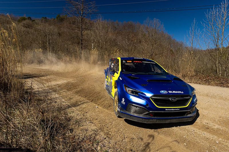 Gravel sprays out from the #199 Subaru WRX ARA24 rally car
