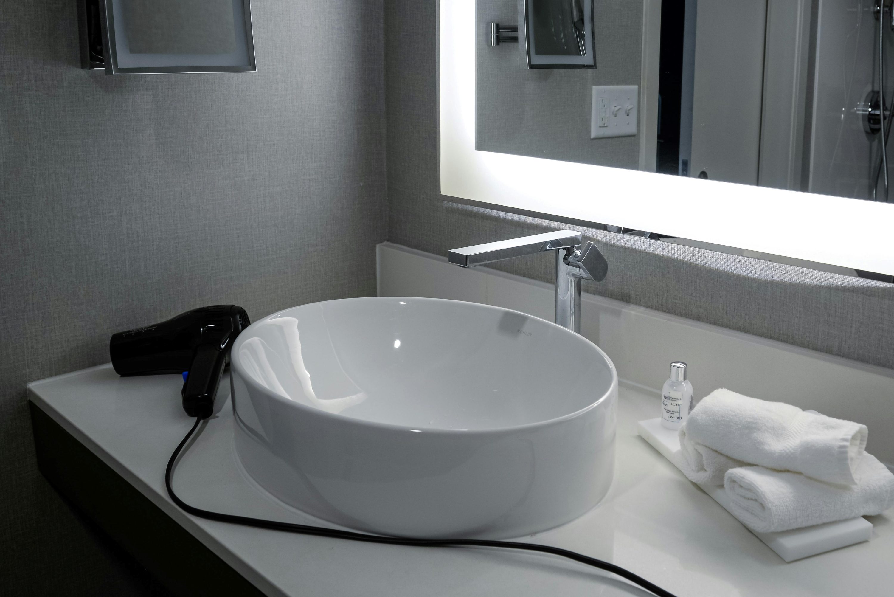 Hair dryer on bathroom sink