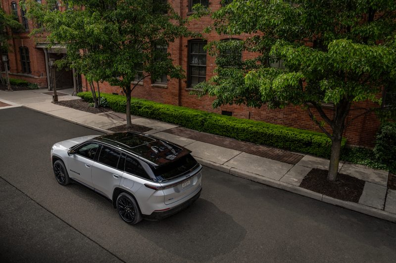Jeep Wagoneer S Launch Edition driving on a city street next to brick building