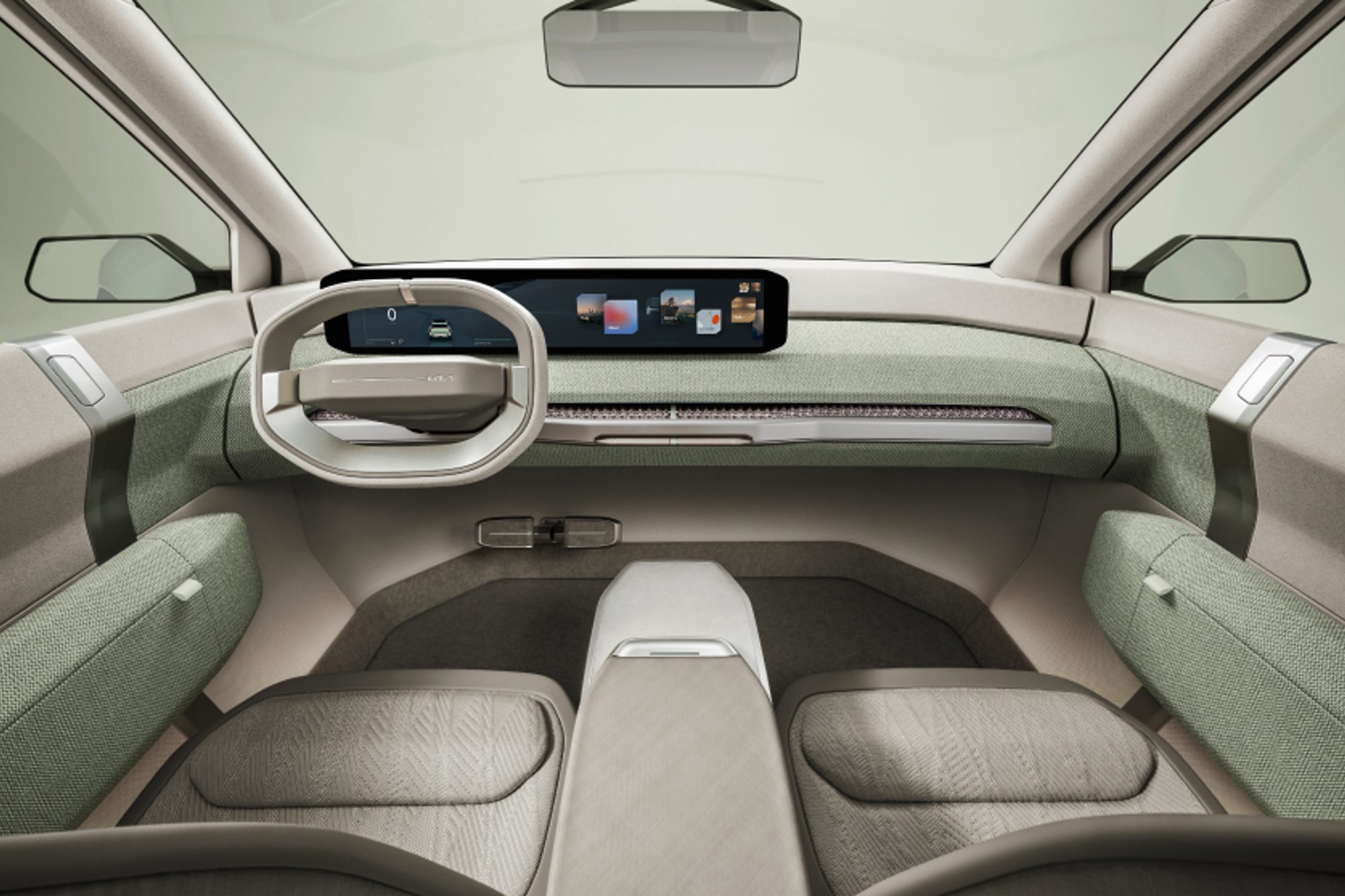 Kia EV3 Concept view of the front row seating, dashboard, and center console.