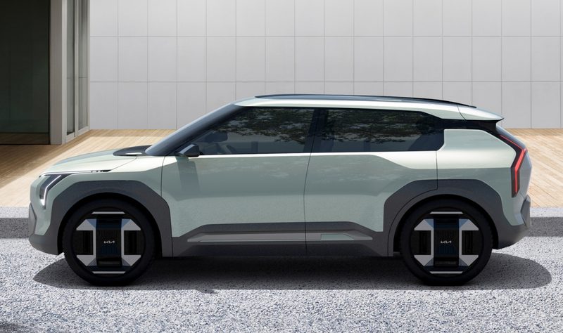 Kia EV3 Concept left profile view parked by a curb.