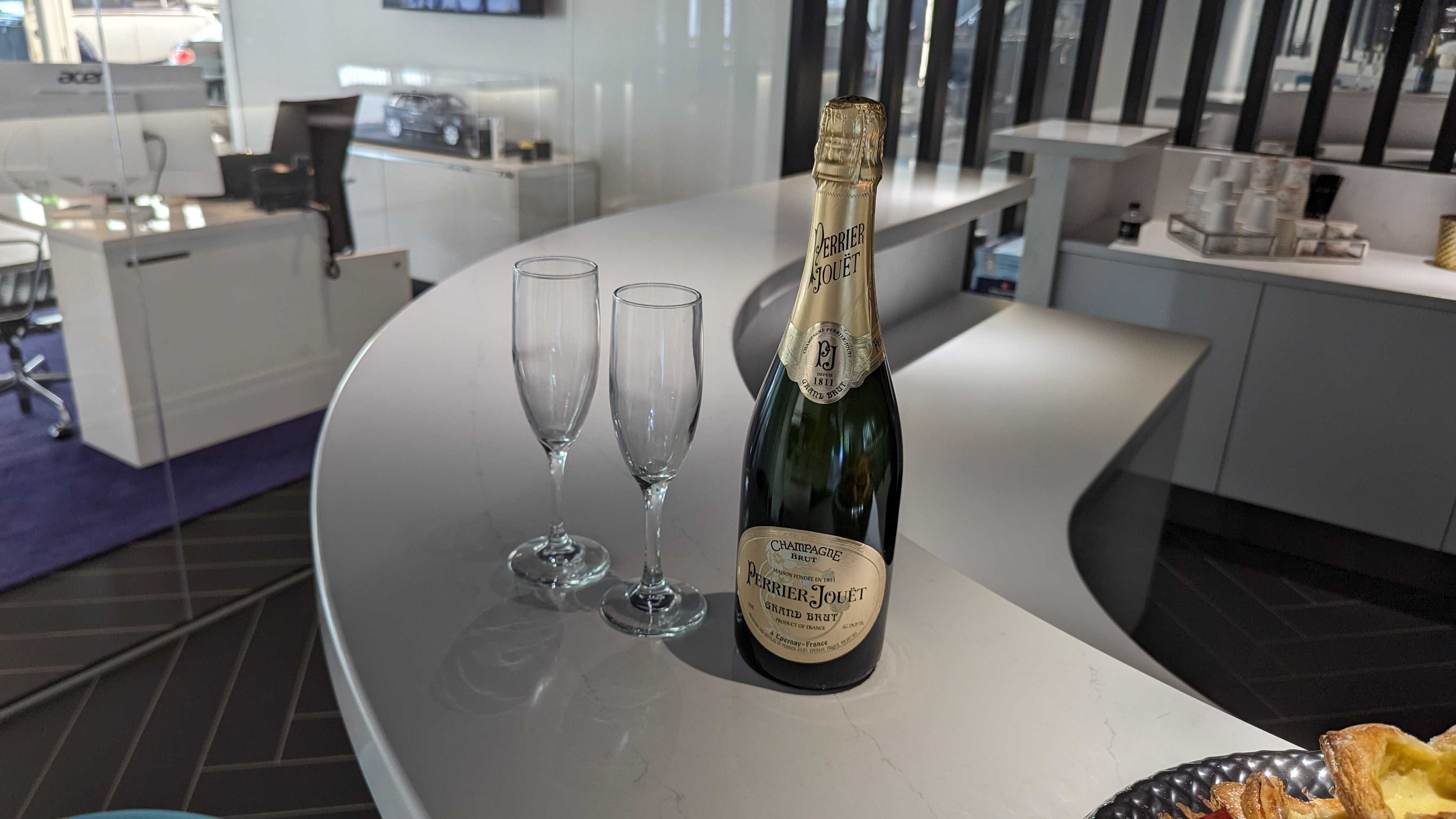 Champagne on the bar of a Rolls Royce dealership